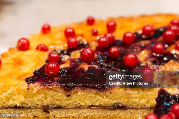 Belle Epoque, London, United Kingdom. Architect: n/a, 2014. Slices of cake with red currants.