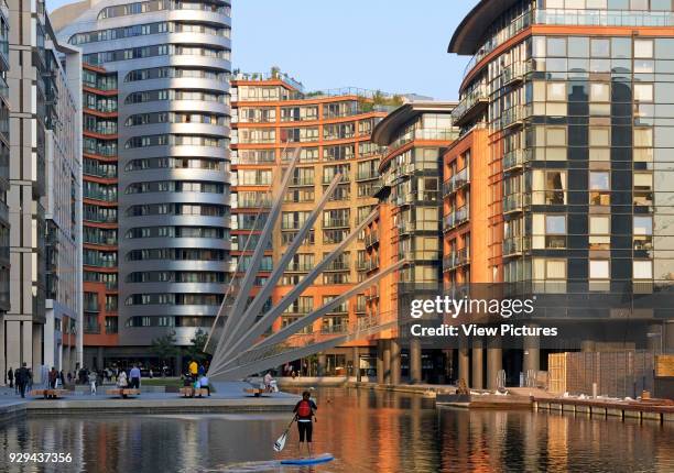 Merchant Square Footbridge, London, United Kingdom. Architect: Knight Architects Limited, 2014. Distant view with bridge in elevated position.