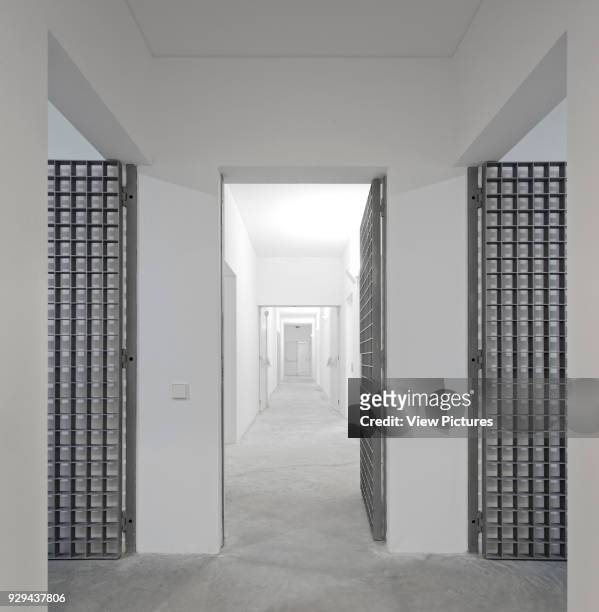 Gated and secured corridors. Palacio da Justicia de Gouveia, Gouveia, Portugal. Architect: Barbosa & Guimaraes, 2011.