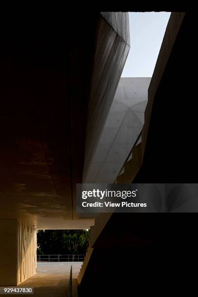 Open staircase with void towards sky. Palacio da Justicia de Gouveia, Gouveia, Portugal. Architect: Barbosa & Guimaraes, 2011.