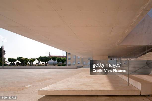 View along stairway's ground floor landing on Plaza. Palacio da Justicia de Gouveia, Gouveia, Portugal. Architect: Barbosa & Guimaraes, 2011.