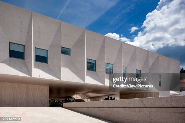 Exterior facade of faceted concrete. Palacio da Justicia de Gouveia, Gouveia, Portugal. Architect: Barbosa & Guimaraes, 2011.