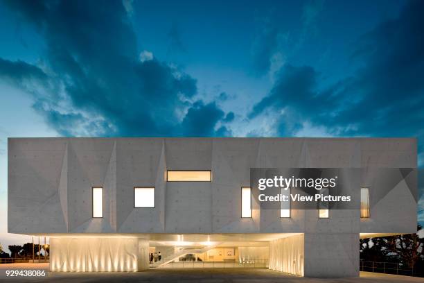 Night elevation of court building on public square. Palacio da Justicia de Gouveia, Gouveia, Portugal. Architect: Barbosa & Guimaraes, 2011.