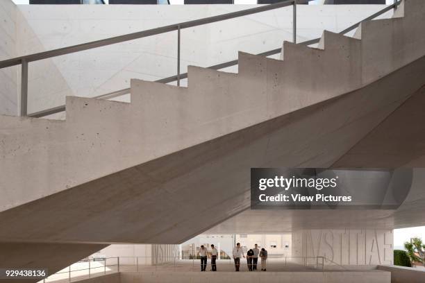 Open stairway leading to upper floor court rooms. Palacio da Justicia de Gouveia, Gouveia, Portugal. Architect: Barbosa & Guimaraes, 2011.