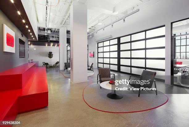 Main reception and gathering area with view of conference room with retractable wall down. Tribeca Office, New York City, United States. Architect:...
