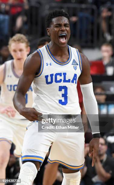 Aaron Holiday of the UCLA Bruins reacts after hitting a 3-pointer against the Stanford Cardinal during a quarterfinal game of the Pac-12 basketball...