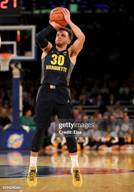 Andrew Rowsey of the Marquette Golden Eagles takes a shot in the first half against the Villanova Wildcats during quarterfinals of the Big East...