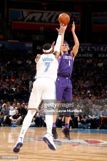 Devin Booker of the Phoenix Suns shoots the ball against Carmelo Anthony of the Oklahoma City Thunder during the game between the two teams on March...