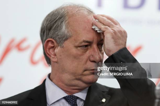 Brazilian former Minister Ciro Gomes, dries his forehead during the launch of his presidential pre-candidacy for the Democratic Labor Party , ahead...