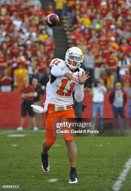 Quarterback Zac Robinson of the Oklahoma State Cowboys throws during play against the Iowa State Cyclones in the second half of play at Jack Trice...