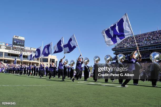 Kansas State Wildcats Cheerleaders rush onto the field before a game against the Kansas Jayhawks on November 7, 2009 at Bill Snyder Family Stadium in...