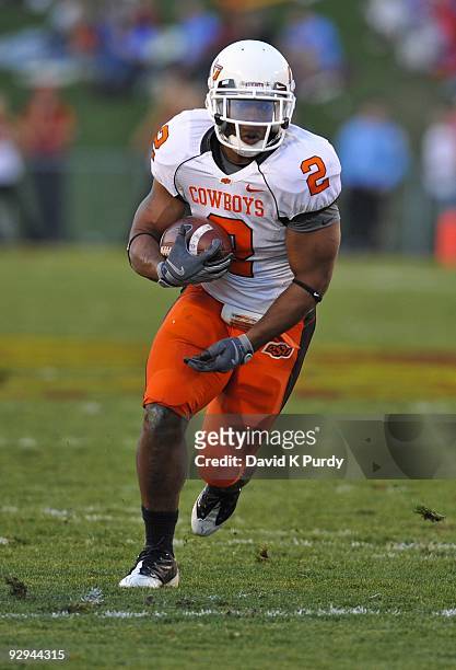 Running back Beau Johnson of the Oklahoma State Cowboys rushes for yards during the game against the Iowa State Cyclones at Jack Trice Stadium on...