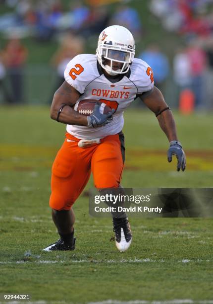 Running back Beau Johnson of the Oklahoma State Cowboys rushes for yards during the game against the Iowa State Cyclones at Jack Trice Stadium on...