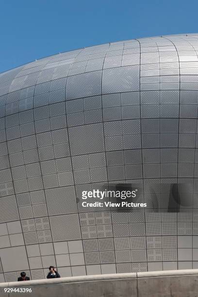 Dongdaemun Design Plaza , Seoul, Korea, South. Architect: Zaha Hadid Architects, 2014. Afternoon elevated view of shapely facade of aluminium panels...