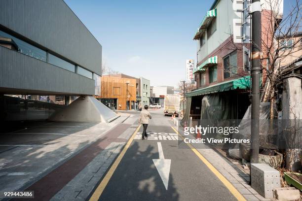 Contextual view of street and neighbourhood. Songwon Art Center / Bien-etre Restaurant, Seoul, Korea, South. Architect: Mass Studies, 2012.