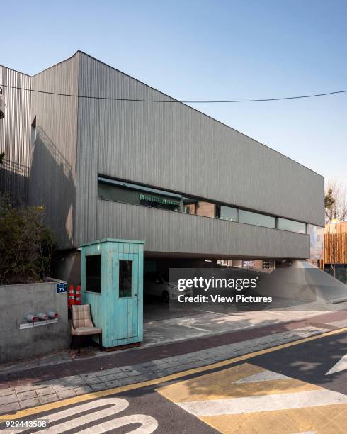 Steel facade with oblong window. Songwon Art Center / Bien-etre Restaurant, Seoul, Korea, South. Architect: Mass Studies, 2012.