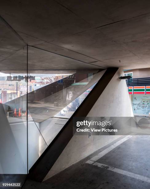 Concrete frame and glazed void admitting daylight. Songwon Art Center / Bien-etre Restaurant, Seoul, Korea, South. Architect: Mass Studies, 2012.