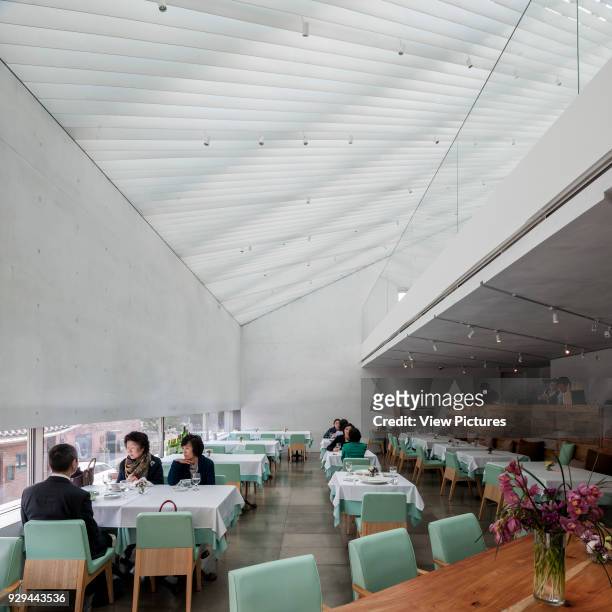 Restaurant interior with louvred skylight. Songwon Art Center / Bien-etre Restaurant, Seoul, Korea, South. Architect: Mass Studies, 2012.
