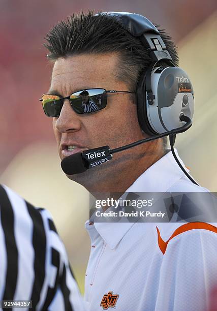 Head coach Mike Gundy of the Oklahoma State Cowboys speaks to an official during the game against the Iowa State Cyclones at Jack Trice Stadium on...