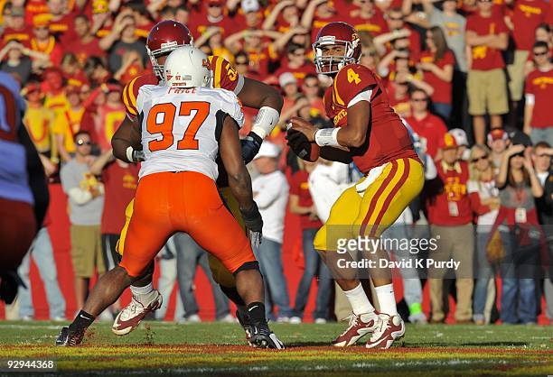 Defensive end Jermiah Price of the Oklahoma State Cowboys puts pressure on quarterback Austen Arnaud of the Iowa State Cyclones in the first half of...