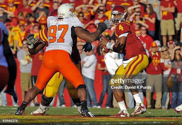 Defensive end Jermiah Price of the Oklahoma State Cowboys puts pressure on quarterback Austen Arnaud of the Iowa State Cyclones in the first half of...