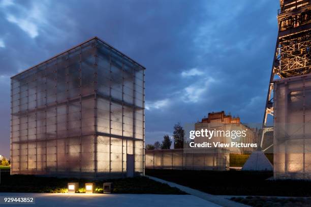 Illuminated building ensemble at night. Silesian Museum, Katowice, Poland. Architect: Riegler Riewe Architekten, 2014.