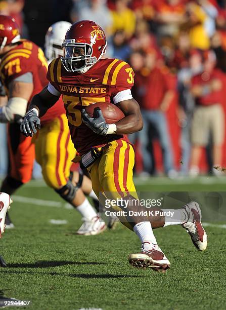 Running back Alexander Robinson of the Iowa State Cyclones rushes for yards in the first half of play against the Oklahoma State Cowboys at Jack...