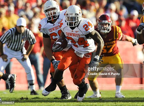 Running back Kendall Hunter of the Oklahoma State Cowboys rushes for yards up the middle against the Iowa State Cyclones in the first half of play at...