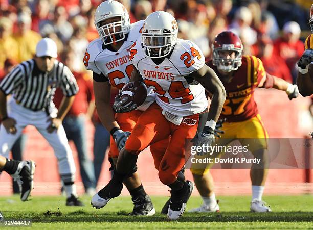 Running back Kendall Hunter of the Oklahoma State Cowboys rushes for yards up the middle against the Iowa State Cyclones in the first half of play at...
