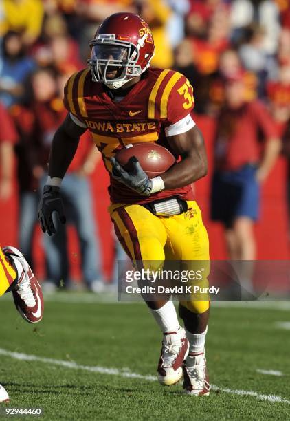 Running back Alexander Robinson of the Iowa State Cyclones rushes for yards in the first half of play against the Oklahoma State Cowboys at Jack...