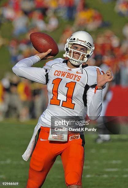 Quarterback Zac Robinson of the Oklahoma State Cowboys warms up before the game against the Iowa State Cyclones at Jack Trice Stadium on November 7,...