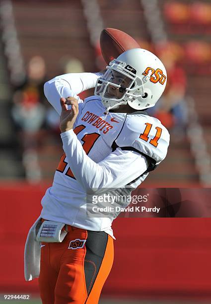 Quarterback Zac Robinson of the Oklahoma State Cowboys warms up before the game against the Iowa State Cyclones at Jack Trice Stadium on November 7,...