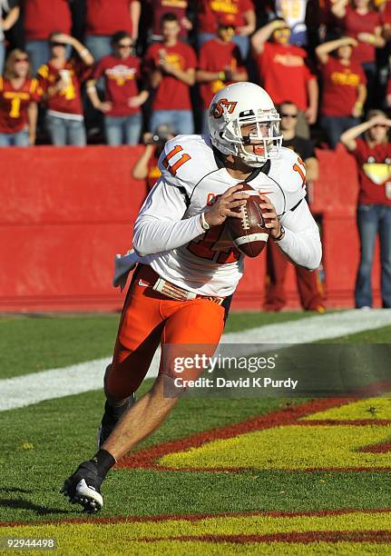 Quarterback Zac Robinson of the Oklahoma State Cowboys rolls out during the game against the Iowa State Cyclones at Jack Trice Stadium on November 7,...