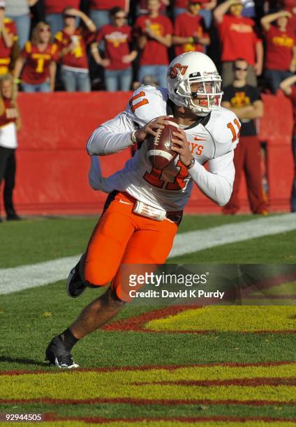 Quarterback Zac Robinson of the Oklahoma State Cowboys rolls out during the game against the Iowa State Cyclones at Jack Trice Stadium on November 7,...