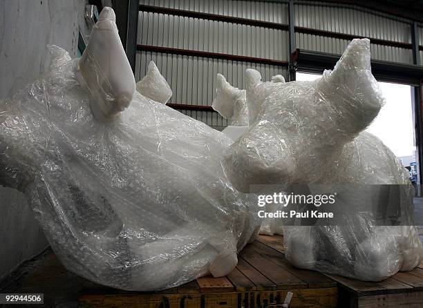 Blank canvas cows sit in a warehouse awaiting collection by artists and ready to be decorated for inclusion in the Cow Parade 2010, at Cowora...