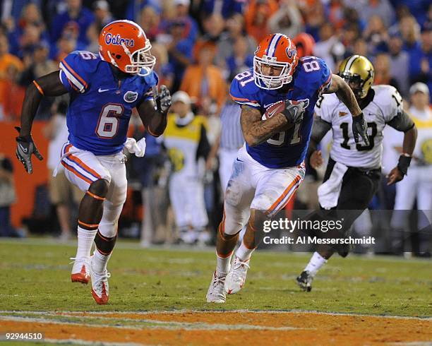 Tight end Aaron Hernandez of the Florida Gators grabs a pass and runs for a 64-yard touchdown against the Vanderbilt Commodores on November 7, 2009...
