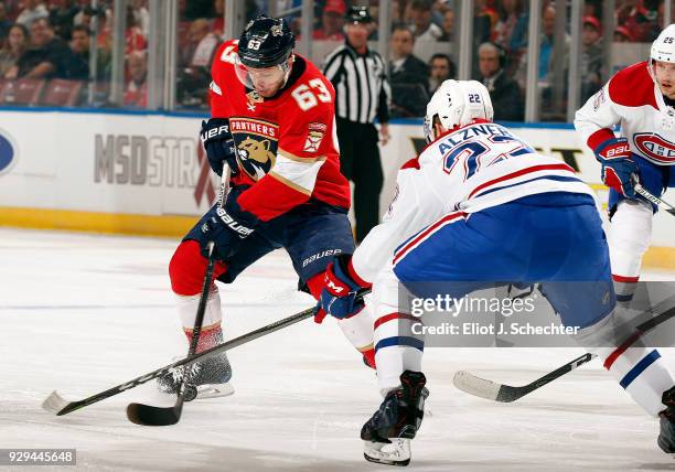 Evgeni Dadonov of the Florida Panthers skates with the puck against Karl Alzner of the Montreal Canadiens at the BB&T Center on March 8, 2018 in...