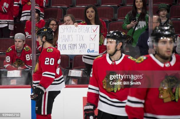 Fan holds up a sign for Brandon Saad of the Chicago Blackhawks prior to the game against the Carolina Hurricanes at the United Center on March 8,...