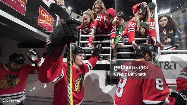 Brandon Saad of the Chicago Blackhawks walks out to the ice prior to the game against the Carolina Hurricanes at the United Center on March 8, 2018...