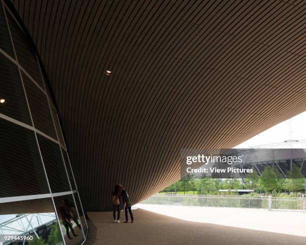 London Aquatics Centre, After The 2012 Games, London, United Kingdom. Architect: Zaha Hadid Architects, 2014. Beneath roof overhang.