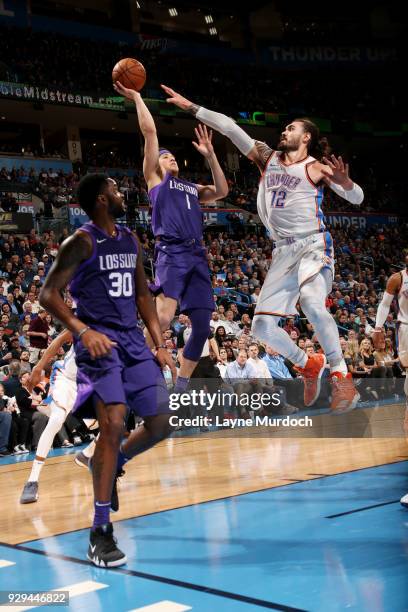 Devin Booker of the Phoenix Suns shoots the ball during the game against the Oklahoma City Thunder on March 8, 2018 at Chesapeake Energy Arena in...