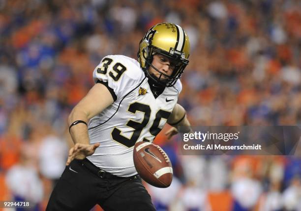 Punter Brett Upson of the Vanderbilt Commodores kicks after a high snap from center against the Florida Gators on November 7, 2009 at Ben Hill...