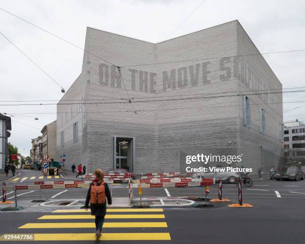 Exterior facade across street, text dark on light. Kunstmuseum Basel, Basel, Switzerland. Architect: Christ & Gantenbein, 2016.