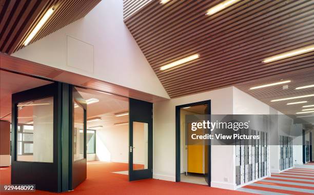 Corridor/ Classroom interior. Whitehorse Manor Junior School at Pegaus Academy, Thornton Heath, United Kingdom. Architect: Hayhurst and Co., 2014.