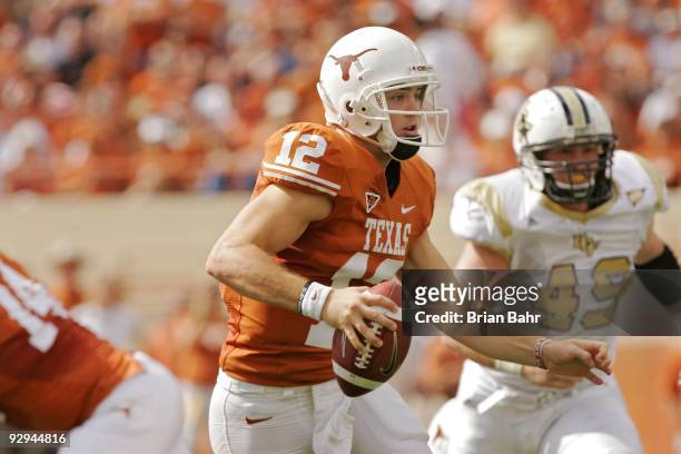Quarterback Colt McCoy of the Texas Longhorns rolls out against the UCF Knights on November 7, 2009 at Darrell K Royal - Texas Memorial Stadium in...