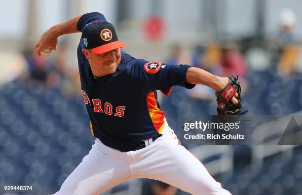 Joe Smith of the Houston Astros in action against the Miami Marlins during a spring training game at Fitteam Ballpark of the Palm Beaches on March 7,...