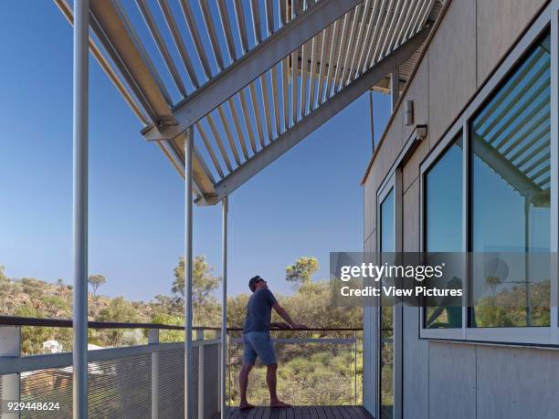 Balcony and landscape. Desert House, Alice Springs, Australia. Architect: Dunn Hillam Architects, 2014.