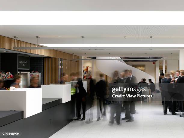 Ground floor buttery with students. Uppingham School Science Centre, Uppingham, United Kingdom. Architect: ORMS Architecture Design, 2014.