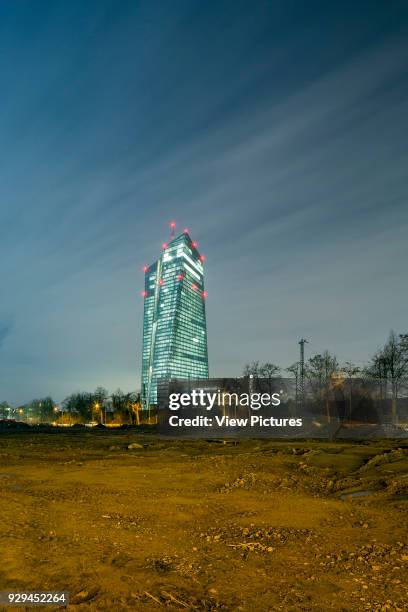 View across construction site to the new European Bank Headquarters. European Central Bank, Frankfurt, Germany. Architect: coop-himmelblau, 2015.