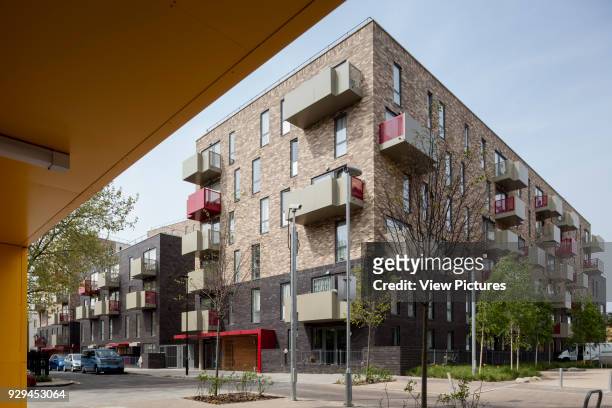 Exteriors, angled view from under portico. Ocean Estate, London, United Kingdom. Architect: Levitt Bernstein, 2015.